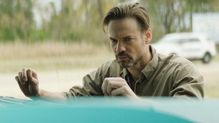 Shane West standing at a car in The Dirty South