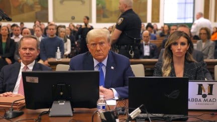 Donald Trump sits in the courtroom with attorneys