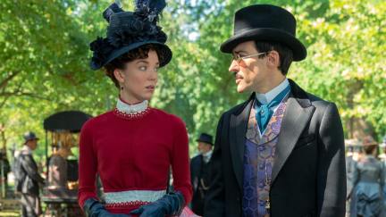 Maud Beaton (Nicole Brydon Bloom) and Oscar van Rhijn (Blake Ritson) walking in the park in 'The Gilded Age.'