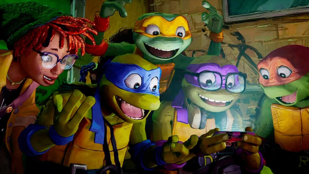 the boys all looking at a phone in teenage mutant ninja turtles mutant mayhem