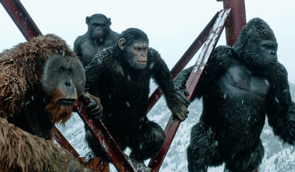 Caesar and the other apes in the snow in War for the Planet of the Apes