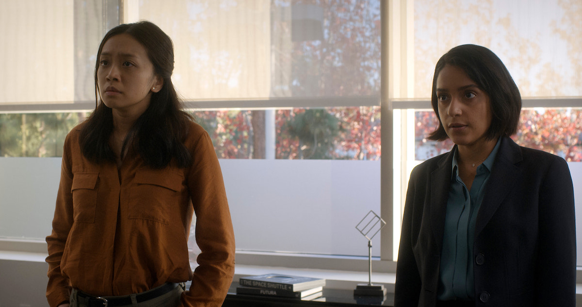 Kelly and Aleida lean against a window in For All Mankind season 4.