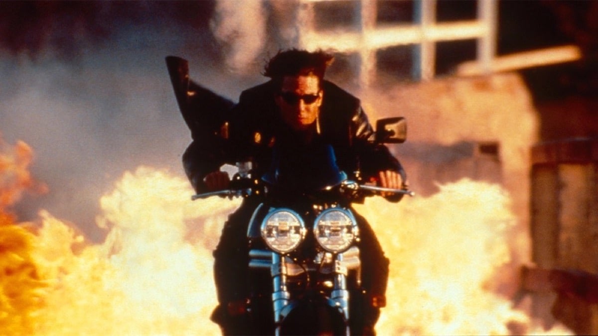 A man rides a motorcycle through flames in "Mission Impossible 2"