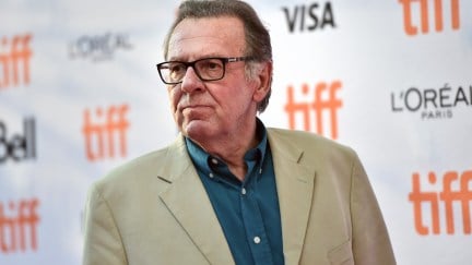 Tom Wilkinson in a blue shirt and tan coat at the Toronto International Film Festival.