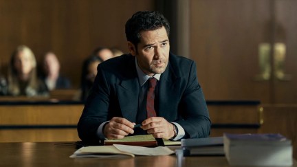 A lawyer sits at his desk in the courtroom in 