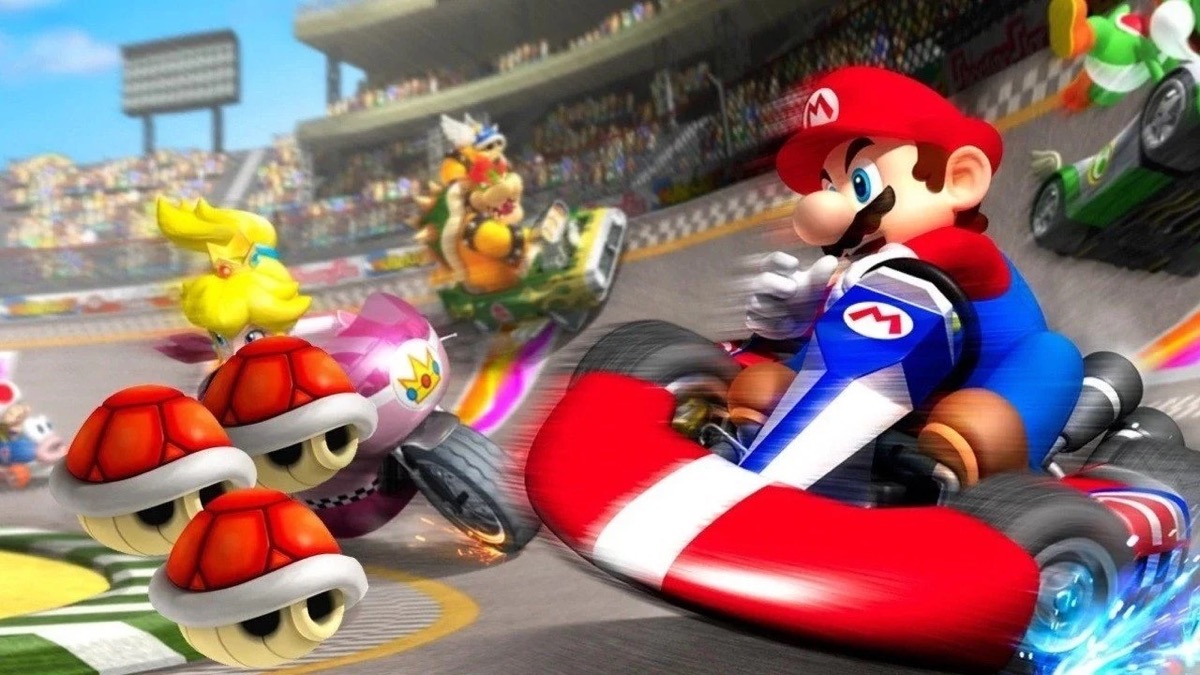 Mario and friends race go karts down a track in "Mario Kart Wii"