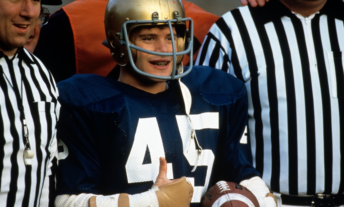 Sean Astin in football gear giving thumbs up in Rudy