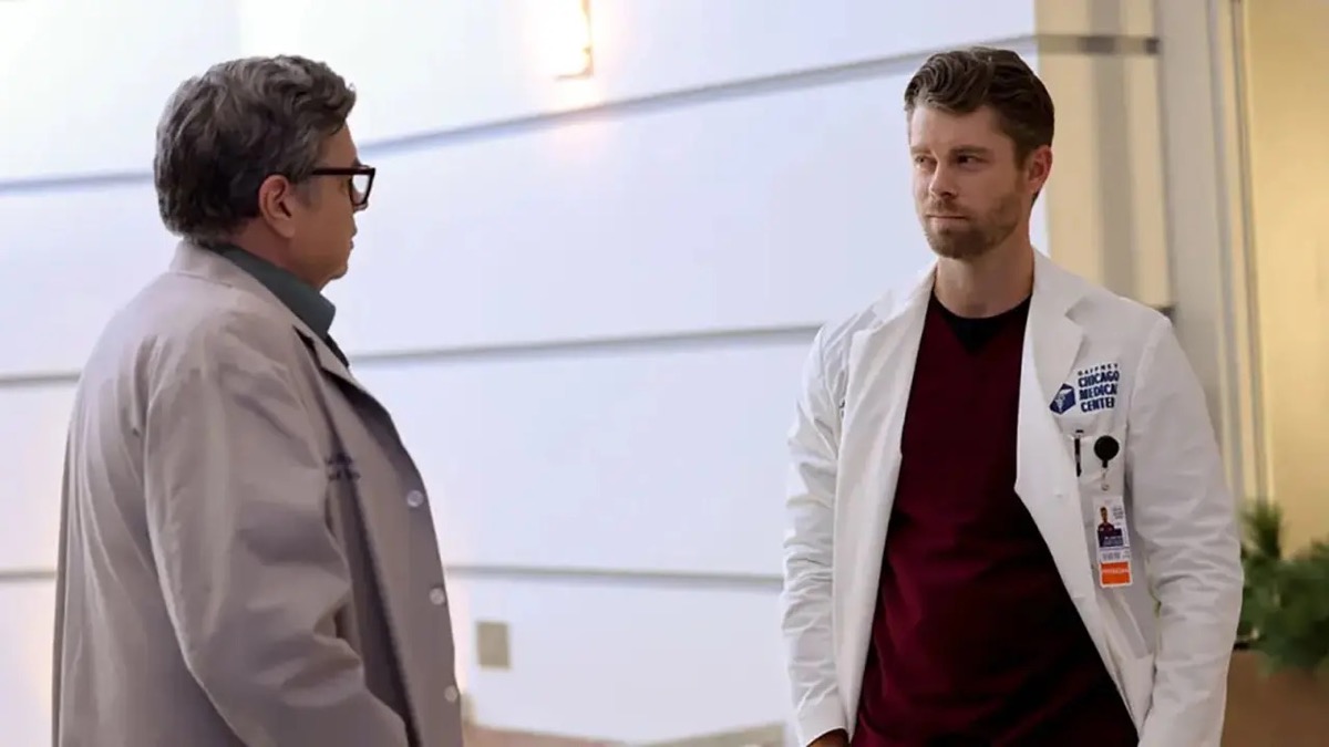 Two male doctors talking in the hallway in "Chicago Med"