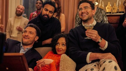 A group of friends (Ruth Negga, Himesh Patel, Dan Levy) sit together on a couch in 'Good Grief.'