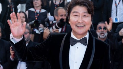 Song Kang-ho waves to the camera at Cannes.