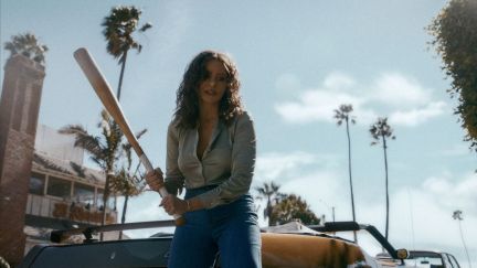 Sofia Vergara as Griselda Blanco, beating a man who stole her product with a baseball bat from Netflix series Griselda.