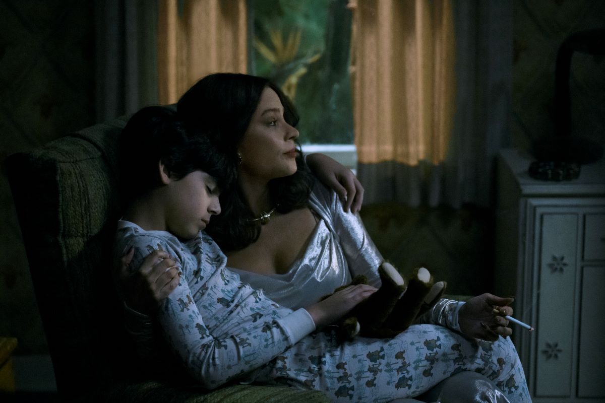 Sofia Vergara as Griselda, holding her youngest child when they first came to Miami in Netflix series, Griselda.