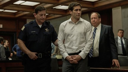 Jake Gyllenhall with handcuffs on and being brought into court in Presumed Innocent.