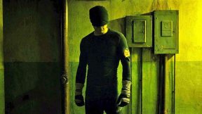 Matt Murdock standing in a hallway listening in his black outfit