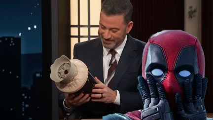 Wade Wilson looking shocked with Jimmy Kimmel behind him holding the Dune popcorn bucket