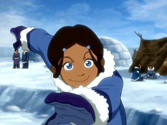 Katara grins and throws something in her South Pole village.