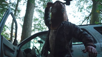 A masked killer prepares to bludgeon an unseen victim in 'In a Violent Nature'