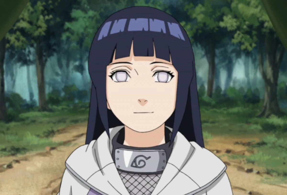 Hinata Hyuga smiles while standing in the woods in "Naruto Shippuden"