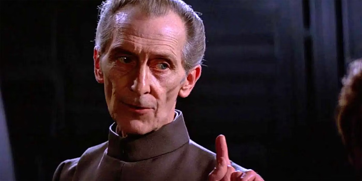 Grand Moff Tarkin raising a finger in command in "Star Wars" 