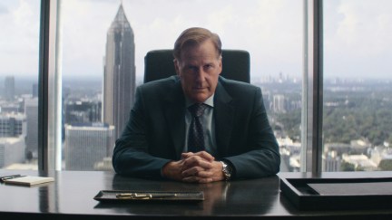 Jeff Daniels sits at a desk in A Man In Full