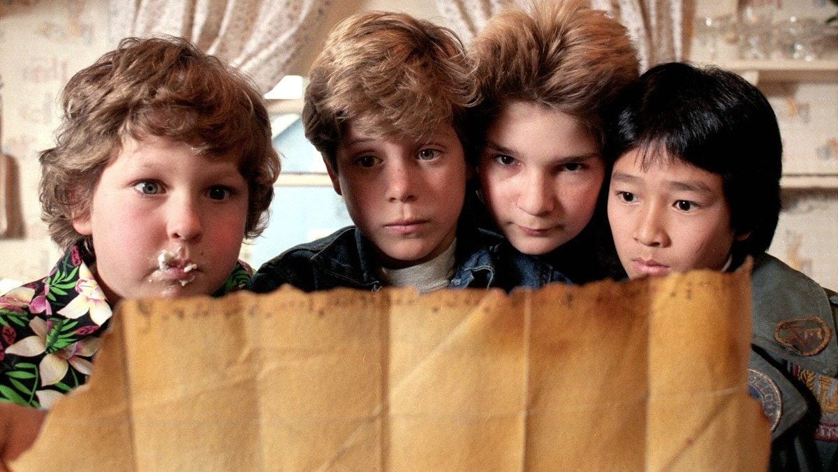 Jeff Cohen as Chunk, Sean Astin as Mikey, Corey Feldman as Mouth and Ke Huy Quan as Data in The Goonies