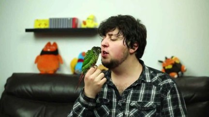 Jonathan Jafari holds a bird in a video on his YouTube channel JonTron