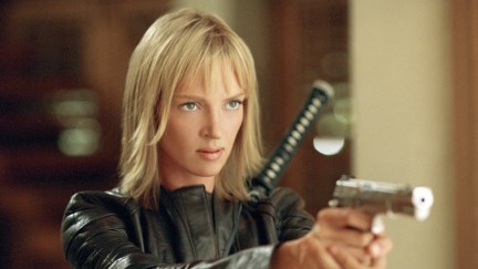 Uma Thurman wears a sword and points a gun in 