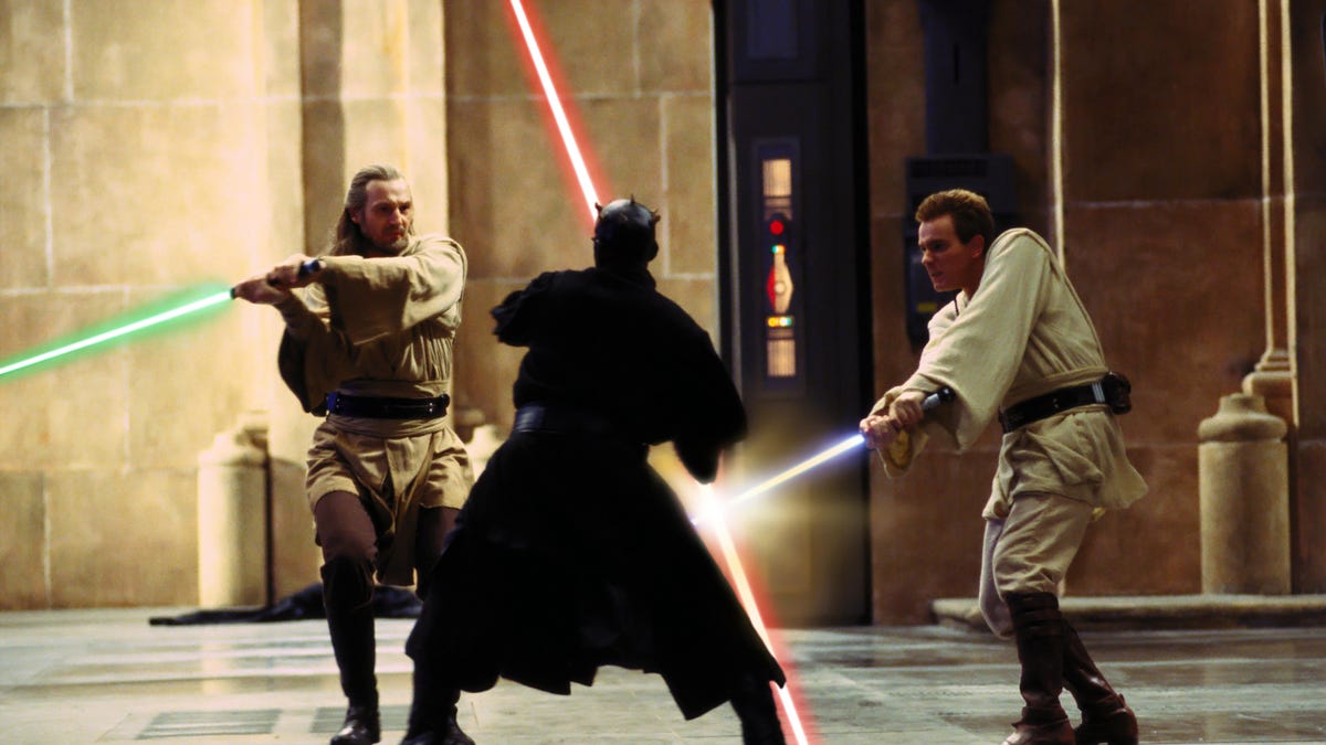 Obi-wan Kenobi, Qui-gon Jinn, and Darth Maul battle with lightsabers.