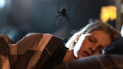 charlotte with a spider hanging over her in the movie sting