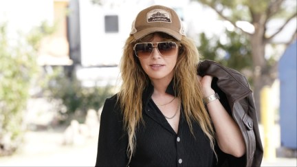 Natasha Lyonne rocks a baseball cap and sunglasses as Charlie Cale in 'Poker Face'.