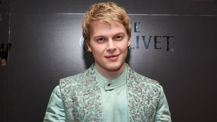 Ronan Farrow standing on a red carpet