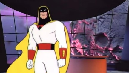 A man in a white and black superhero costume stands in front of a talk show desk with a meteor in the background. From Space Ghost: Coast to Coast.