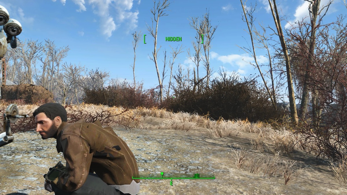 A character crouching in the wasteland in "Fallout 4" 