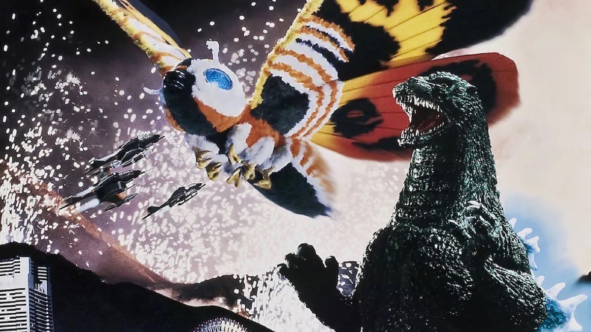 Godzilla roars while Mothra flies in "Godzilla and Mothra- The Battle for Earth"