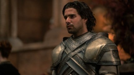 Ser Criston Cole stands in his armor in 