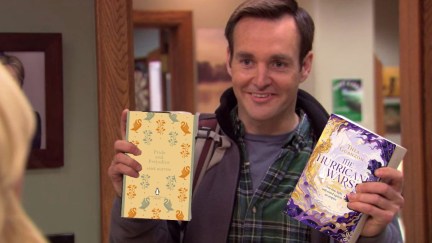 Will Forte from Parks and Rec holding two photoshopped books, Pride and Prejudice and The Hurricane Wars