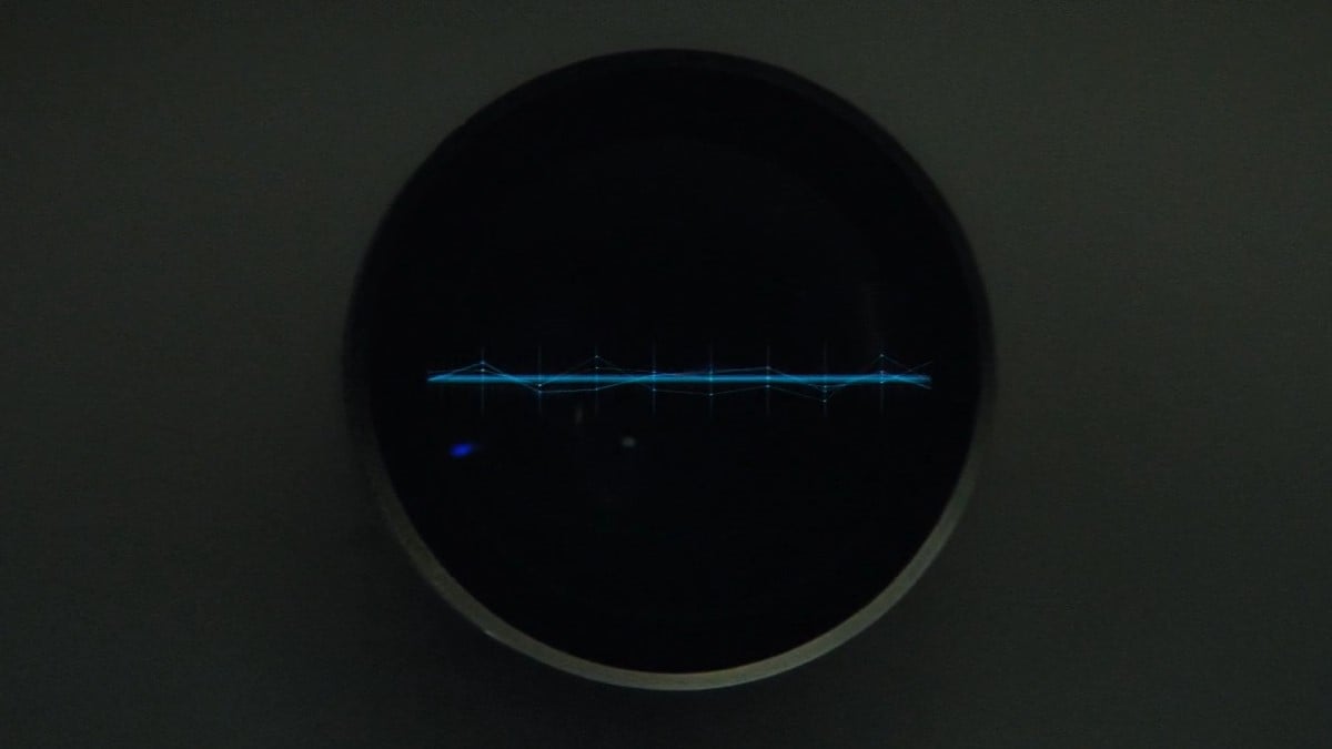 Image of the Zora interface on the 'Star Trek: Short Treks" episode, "Calypso." It is a circular screen with a horizontal line across it that moves with the sound of Zora's voice.