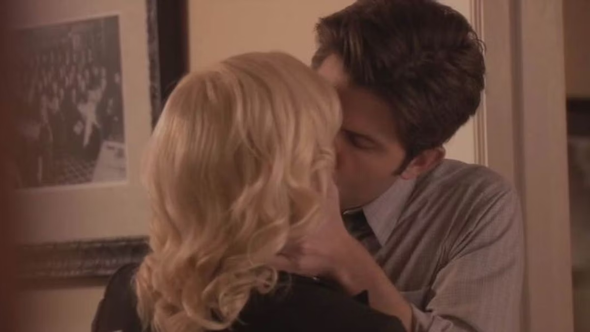 ben and leslie kissing each other
