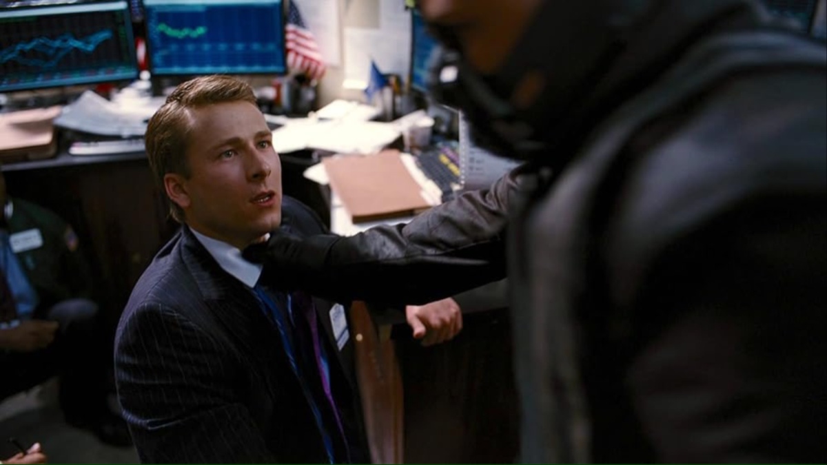 Glen Powell gets choked by Bane in 'The Dark Knight Rises'.