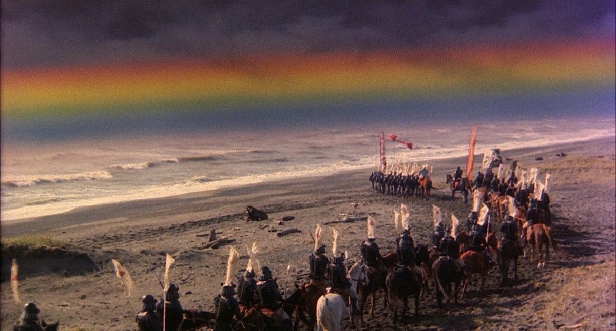 An army of warriors stand on a beach under a rainbow sky in "Kagemusha" 
