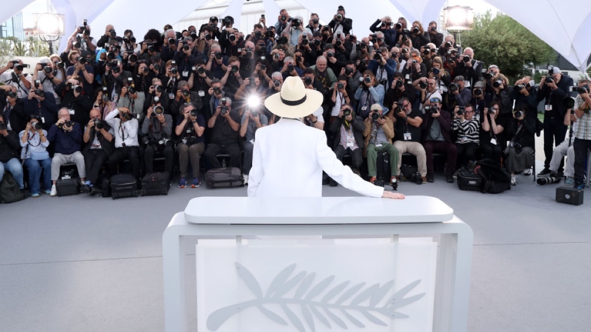 Meryl Streep faces away from the camera, into a sea of photographers, at Cannes 2024.