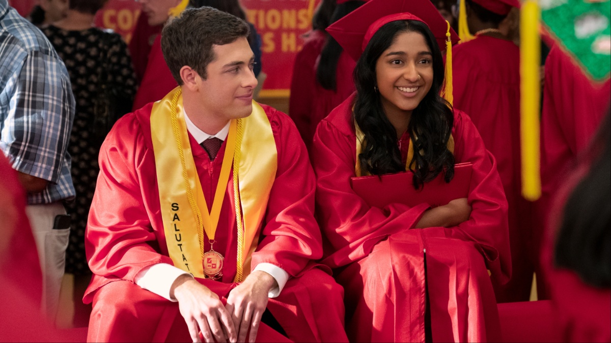 Jaren Lewison as Ben Gross, Maitreyi Ramakrishnan as Devi wear graduation robes in episode 410 of Never Have I Ever.