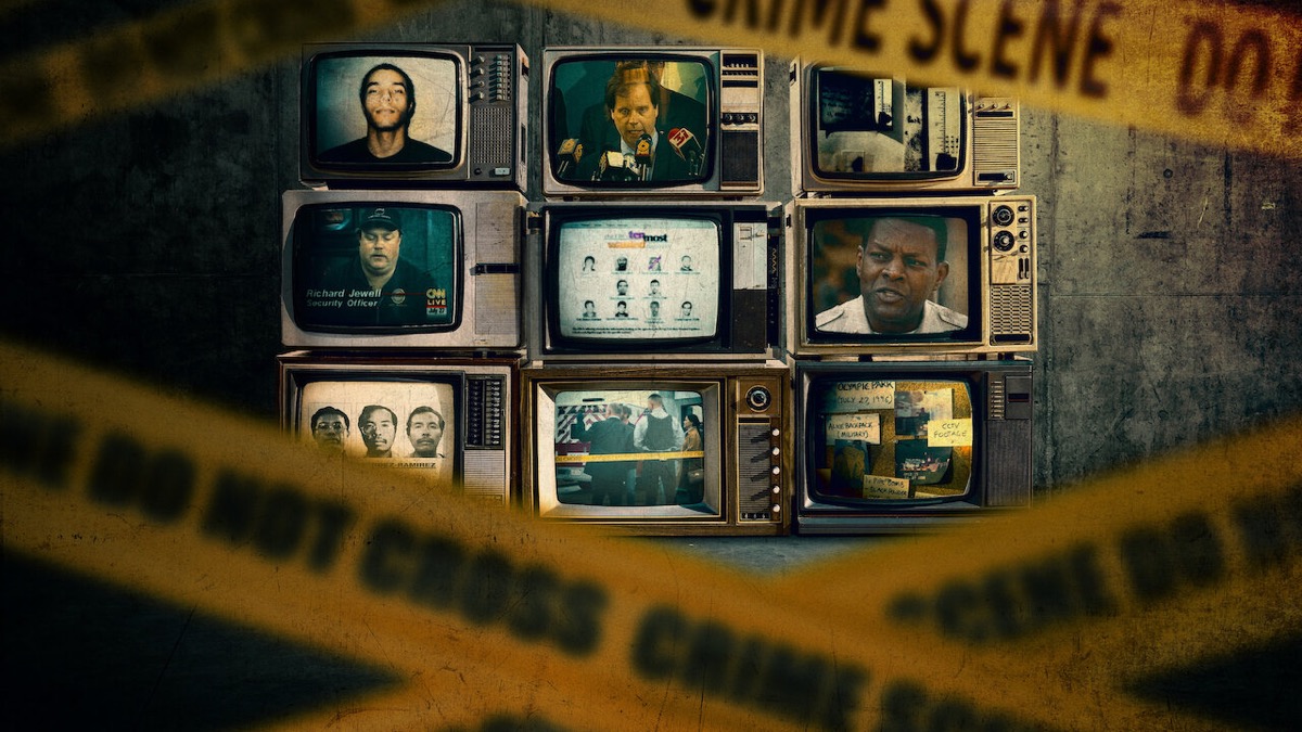 Images of killers on TV screens appear behind caution tape in "Catching Killers"