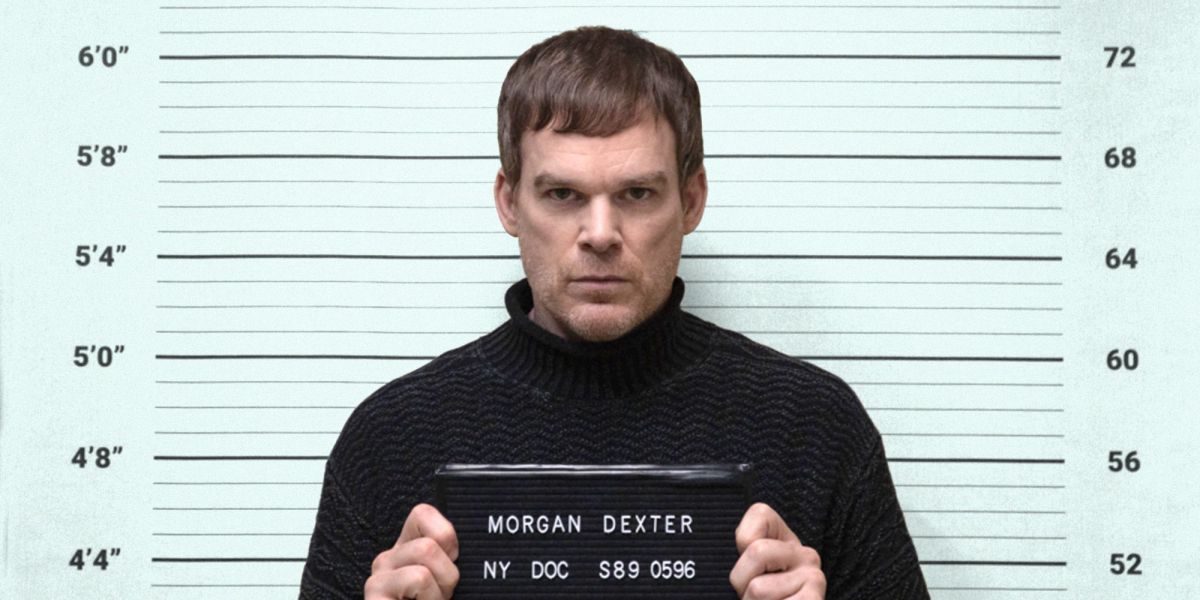 dexter holds up a sign for a mug shot