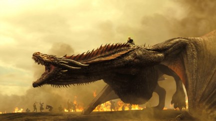 The black dragon Drogon roars on a battlefield while ridden by Daenerys Targaryen in 