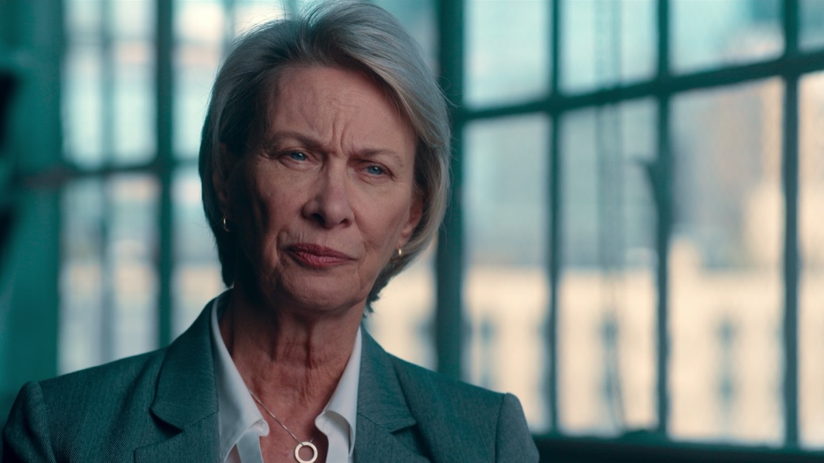 A woman sits for an interview in a brightly lit room in "Homicide New York" 