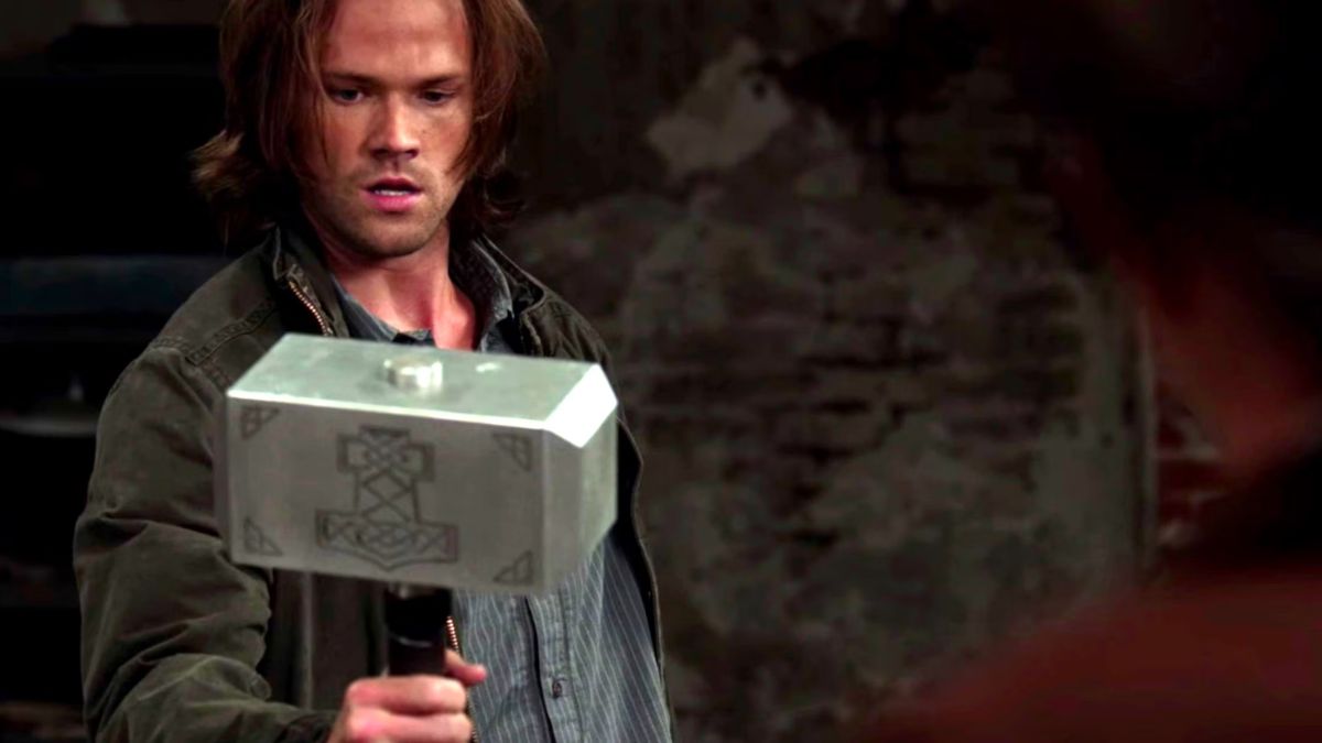 Jared Padalecki as Sam Winchester wields Thor's hammer, Mjolnir in an episode from Supernatural