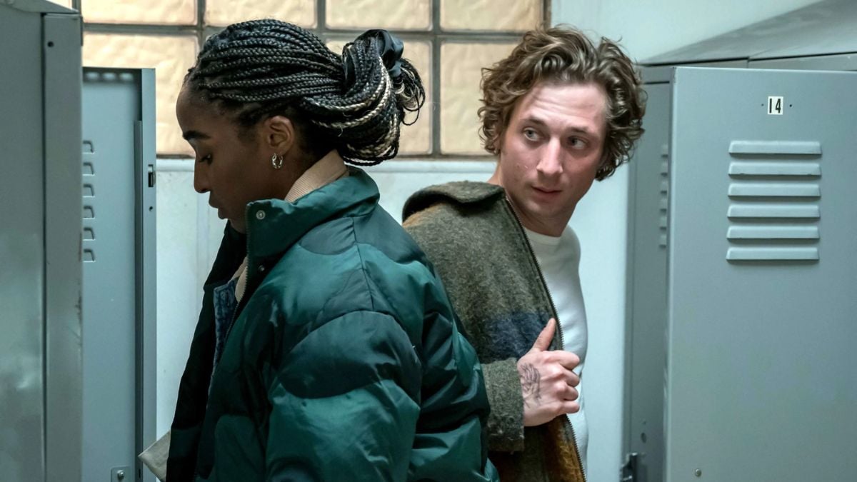Jeremy Allen White as Carmy looks at Ayo Edebiri as Sydney in The Bear