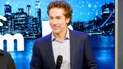 Joel Osteen holding a microphone at SiriusXM Studios