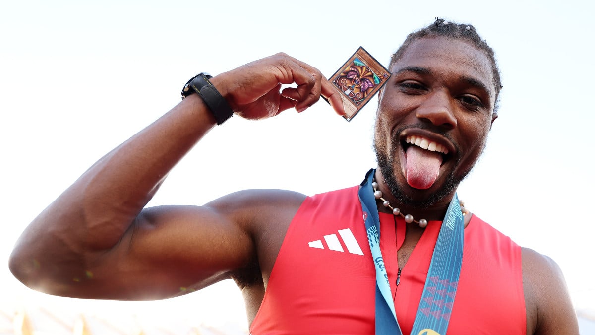 Noah Lyles poses with a Yu Gi Oh card and the gold medal after winning the men's 100 meter final on Day Three 2024 U.S. Olympic Team Trials Track & Field at Hayward Field on June 23, 2024 in Eugene, Oregon